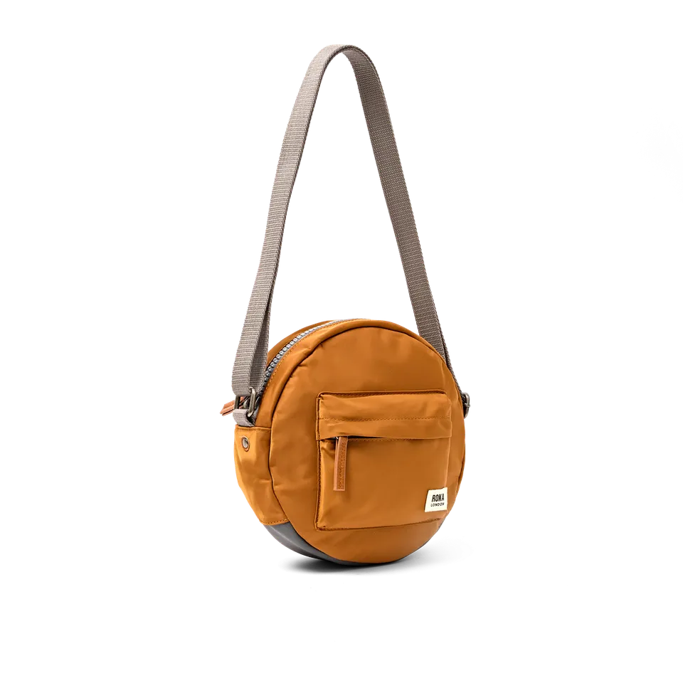 Roka London Paddington rund veske Small Biscuit crossbody 4,1L