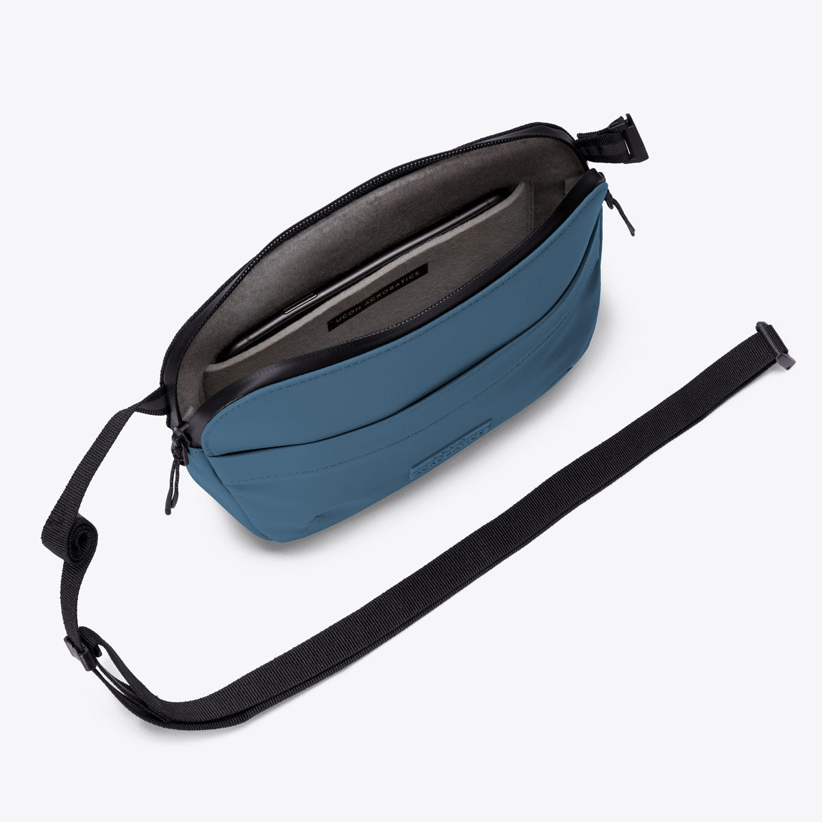 Ucon Acrobatics Melvin Crossbody mageveske petrol ribbet