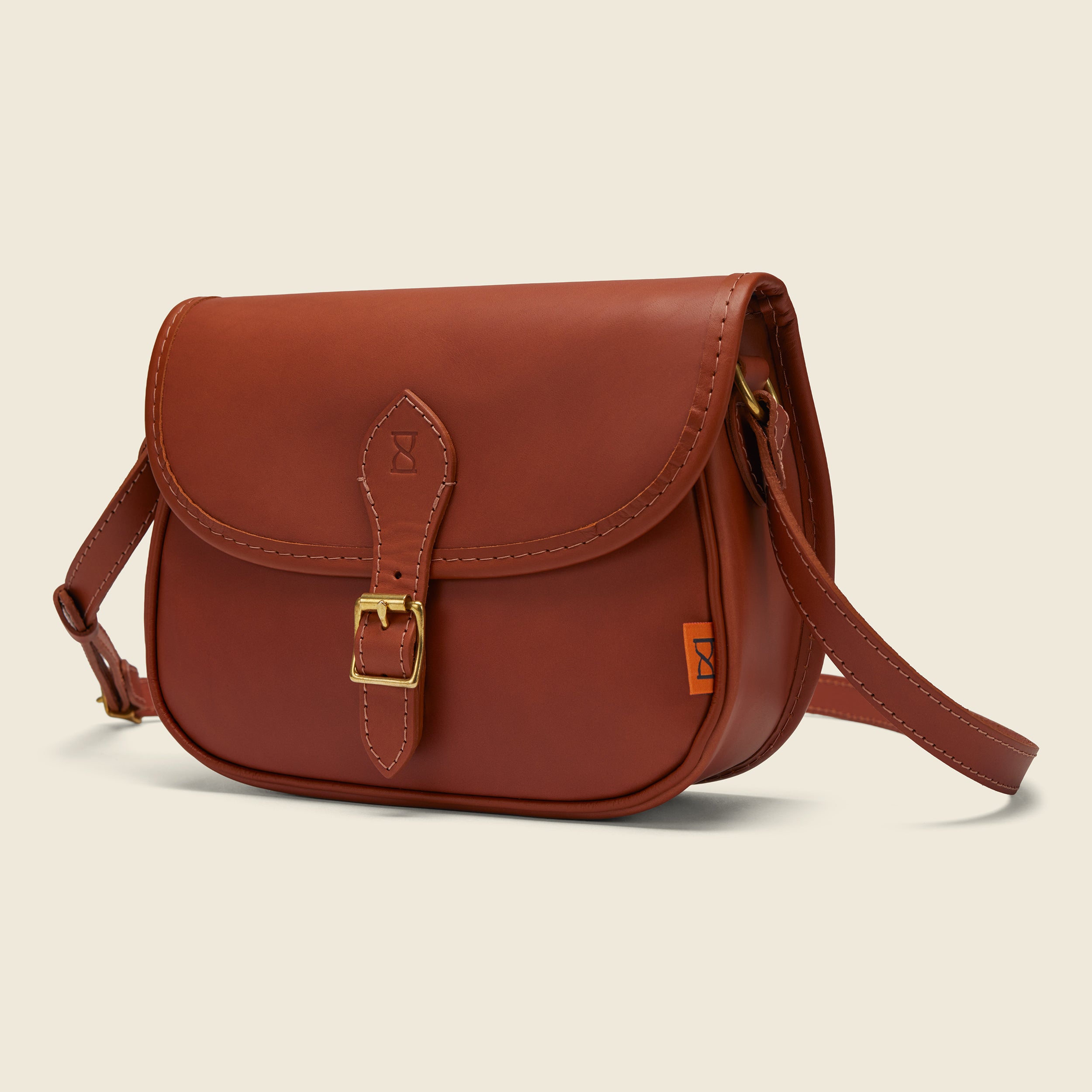 Chapman Saddle skulderveske svart skinn blomsterfôr