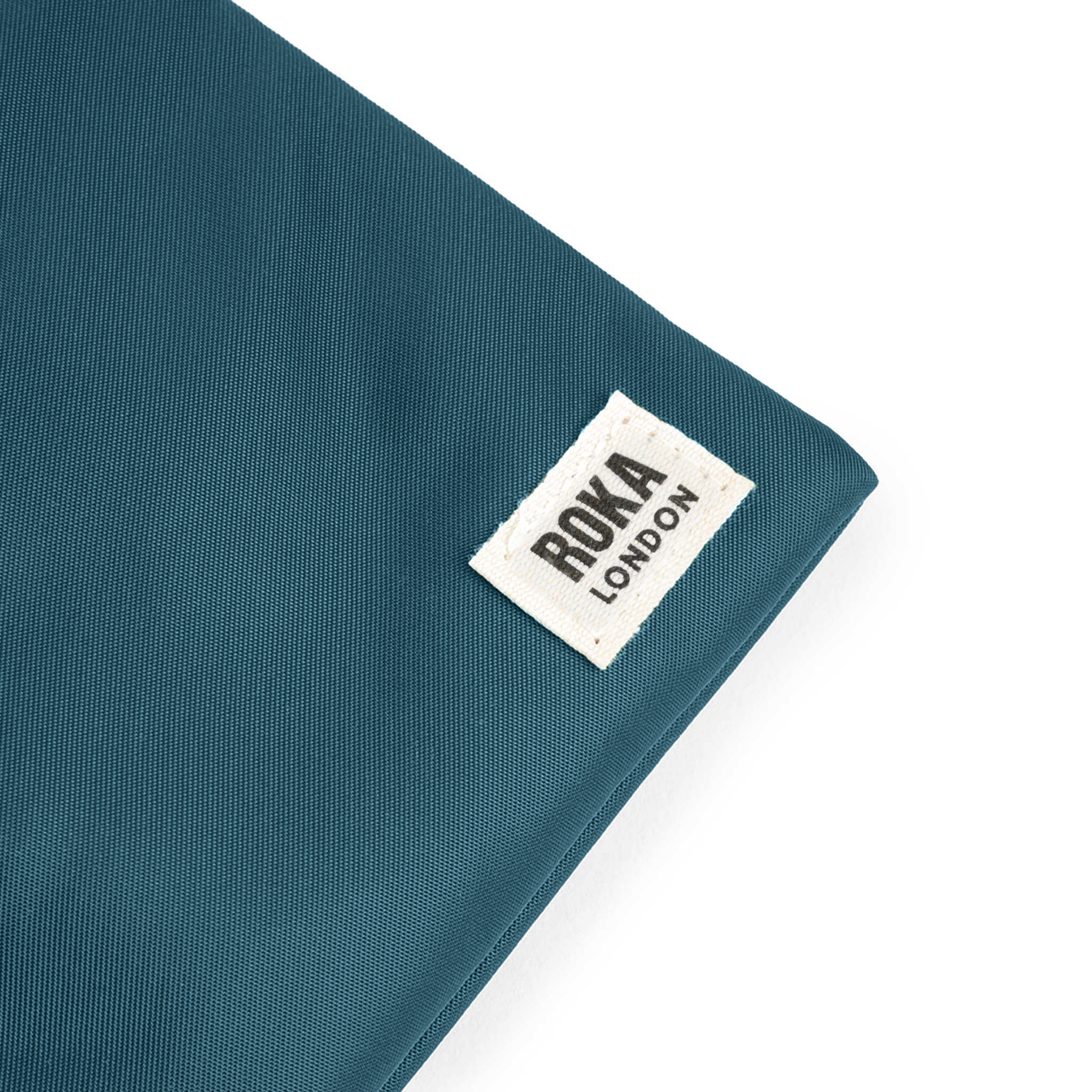Roka London Chelsea Pocket slingbag teal XS 0,3 liter vanntett