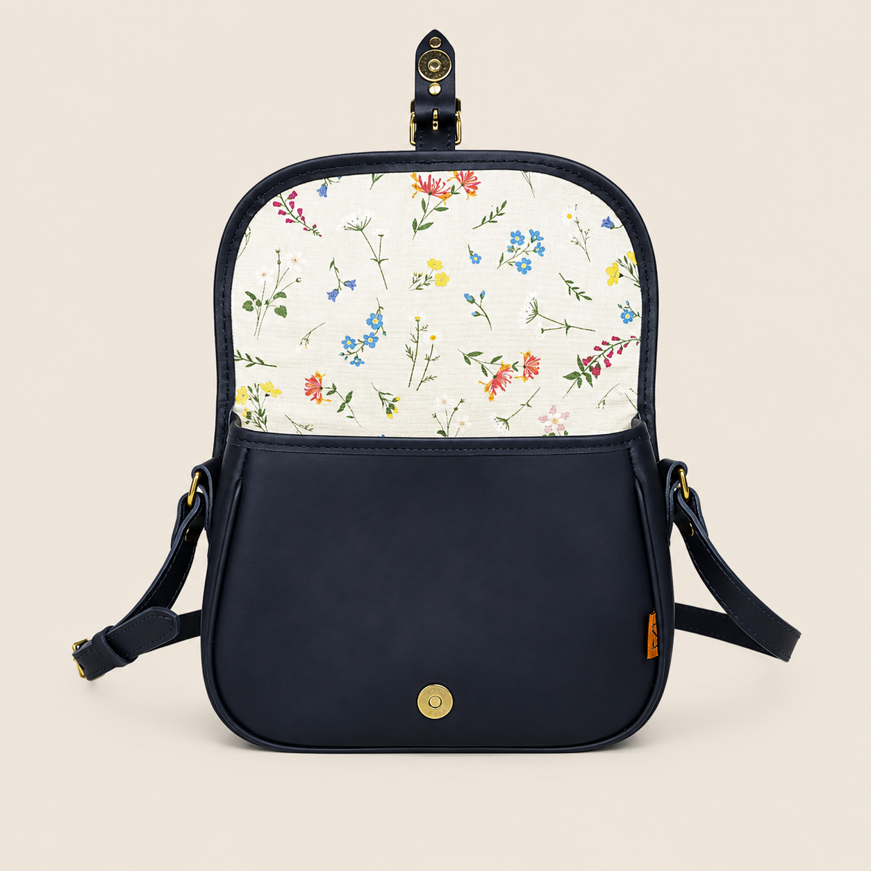Chapman Saddle skulderveske svart skinn blomsterfôr