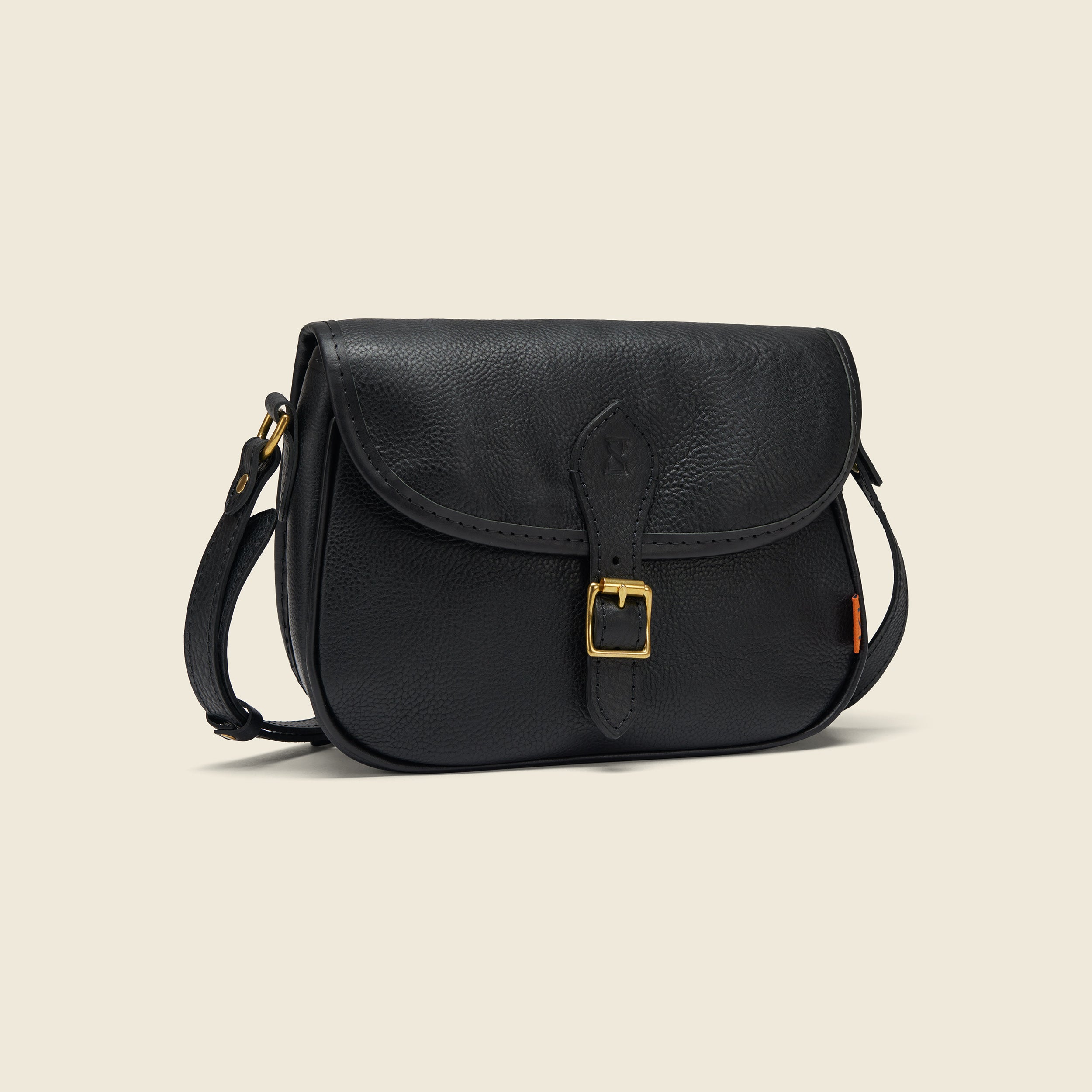 Chapman Saddle skulderveske svart skinn blomsterfôr