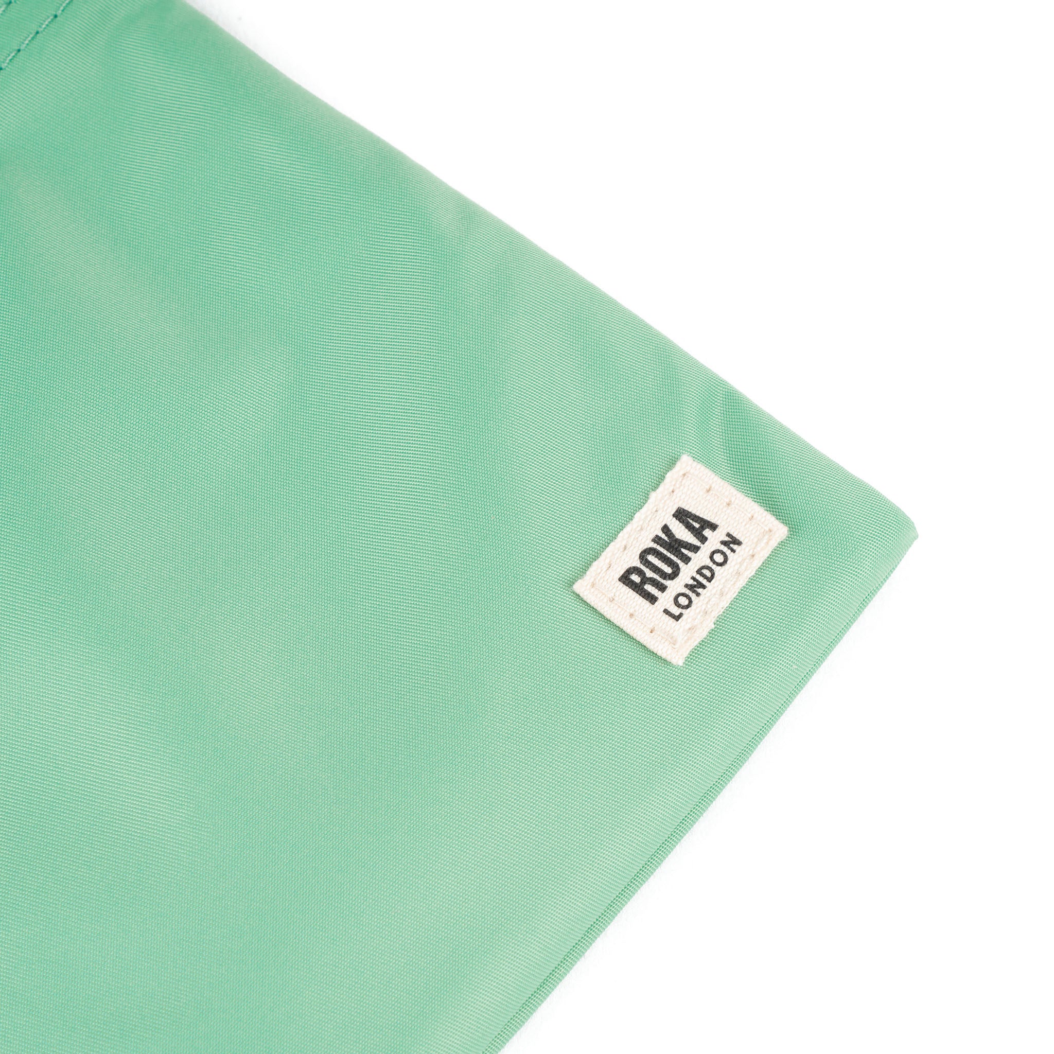 Roka London Chelsea Pocket Sling skulderveske matcha XS værbestandig