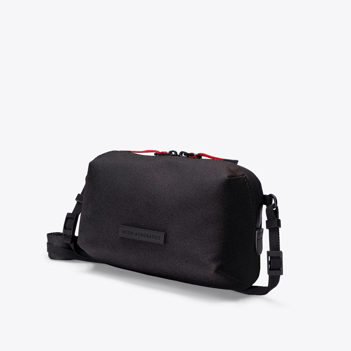 Ucon Acrobatics Ando crossbody-veske Medium Asphalt Reflective lett